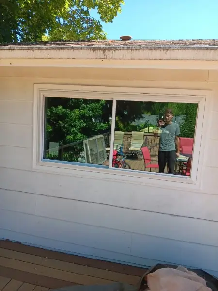 Wide white slider on a single-story ranch